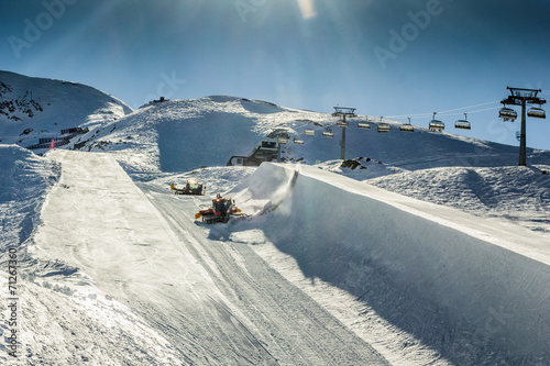 Halfpipe of Kitzsteinhorn ski resort in Austria with grooming ma