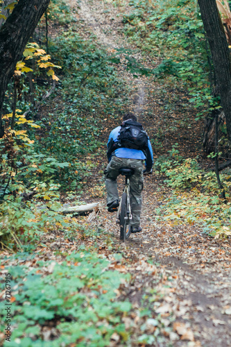 Man with bike in forest