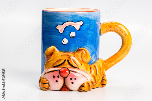 Yellow ceramic mug with dog  on white background