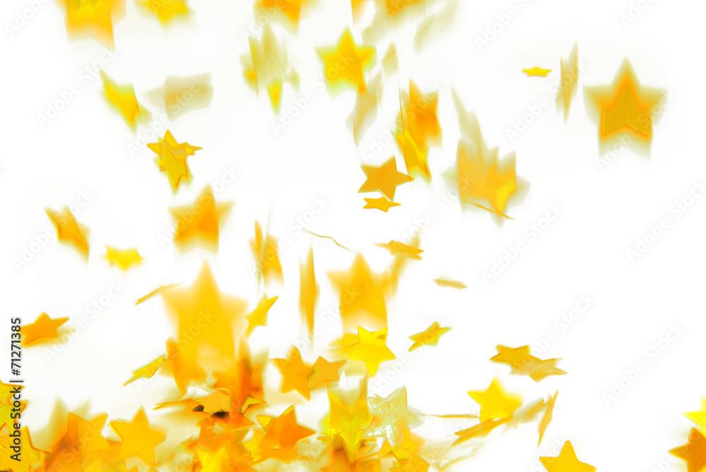 golden confetti  flying isolated on white