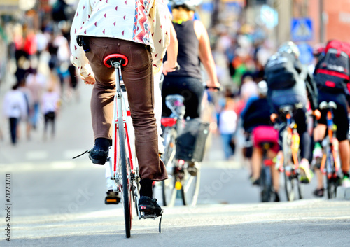 Bikes in traffic, diversified crowd
