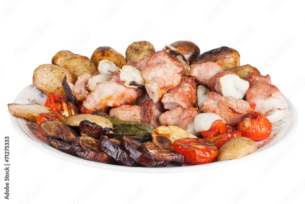 Meat with potatoes, eggplants, tomatoes, onions and peppers on t Meat with potatoes, eggplants, tomatoes, onions and peppers on t