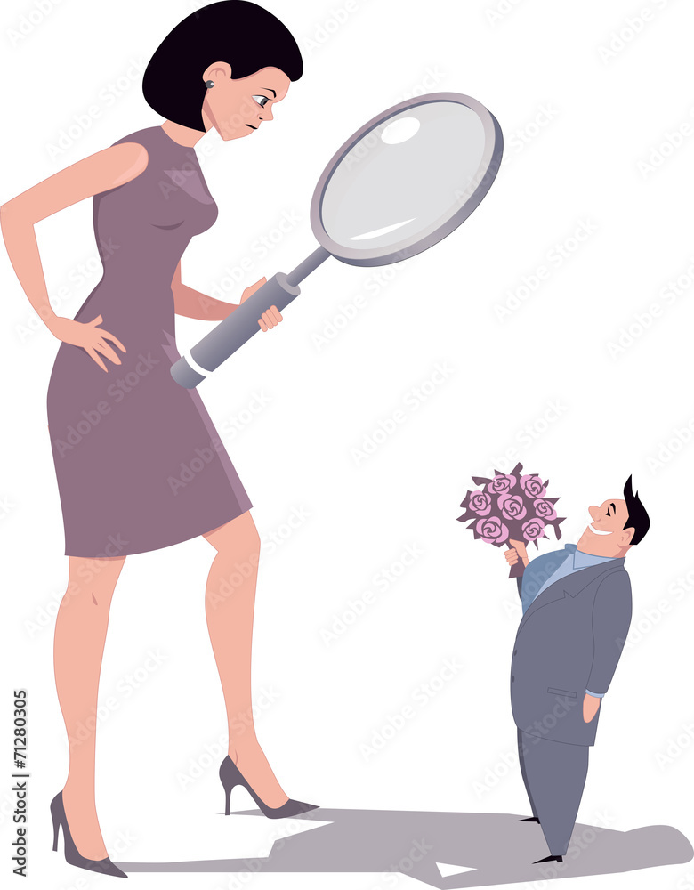Woman looking at a man through a magnifying glass Woman looking at a man through a magnifying glass