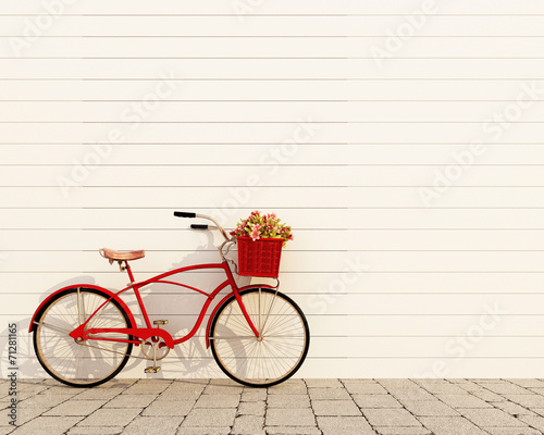 red retro bicycle with basket and flowers photo