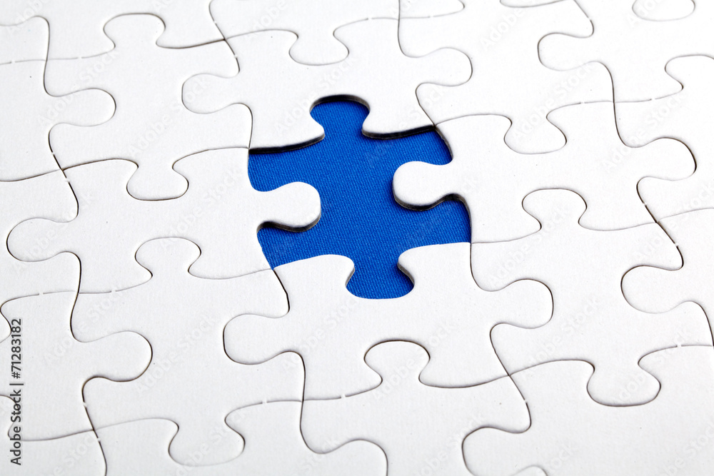 Plain white jigsaw puzzle, on Blue background Plain white jigsaw puzzle, on Blue background