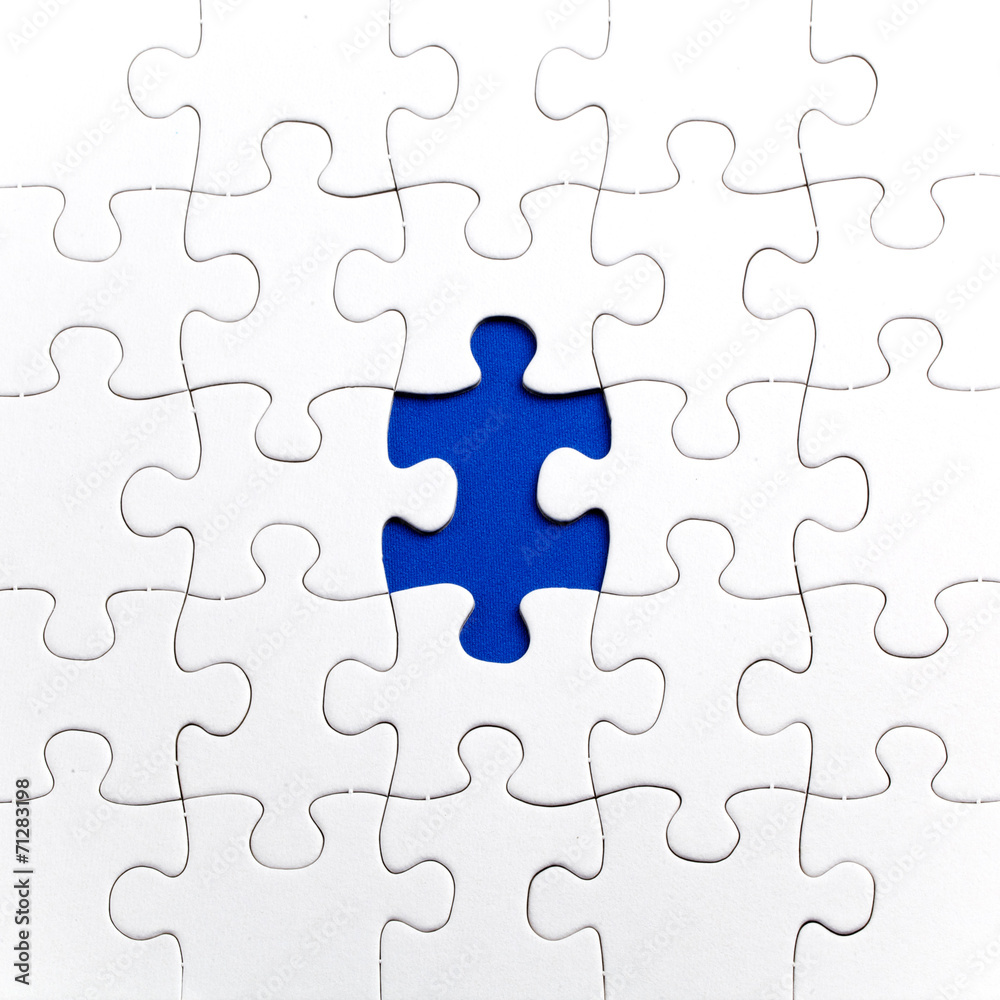 Plain white jigsaw puzzle, on Blue background Plain white jigsaw puzzle, on Blue background