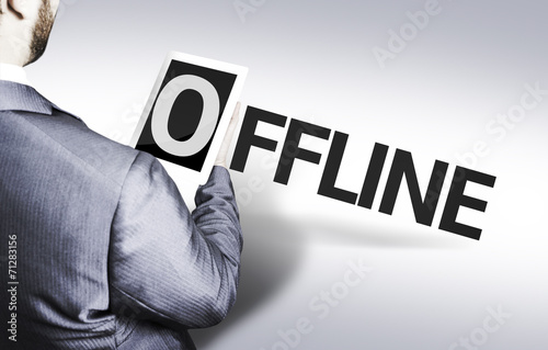 Business man with the text Offline in a concept image photo