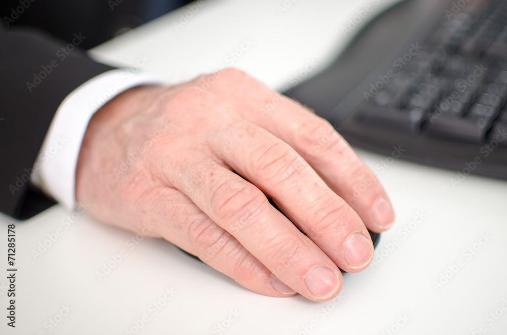 Fototapeta premium Businessman's hand holding a computer mouse