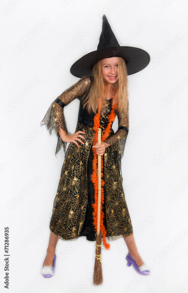 Girl posing in witch dress