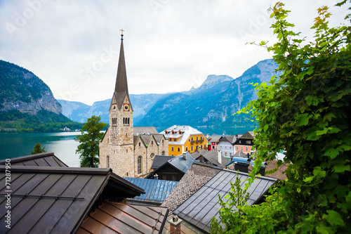 View of Hallstatt village with Christuskirche church bell tower © PixAchi