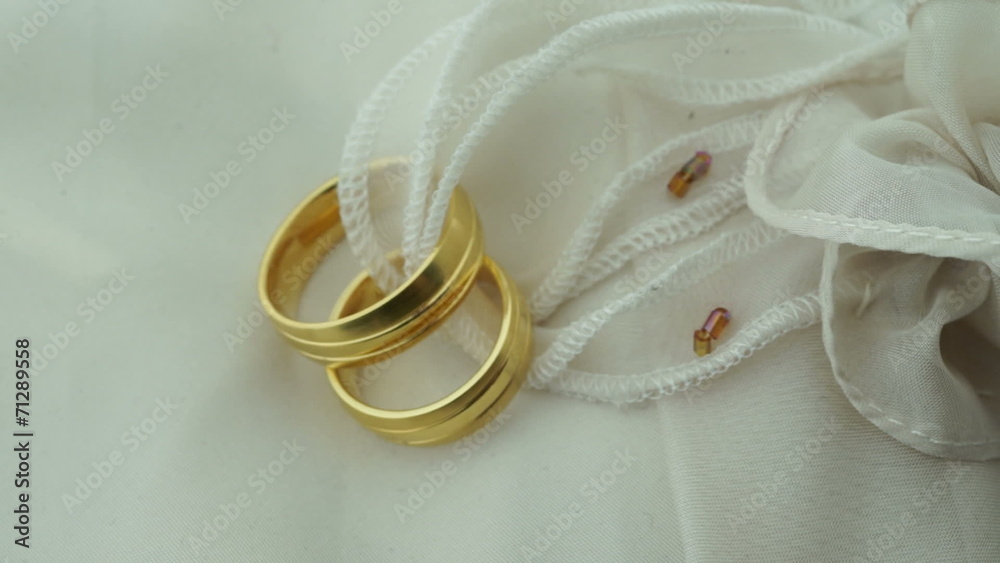 Wedding rings on ring pillow focus shift