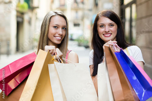Girls with shopping bags © JackF