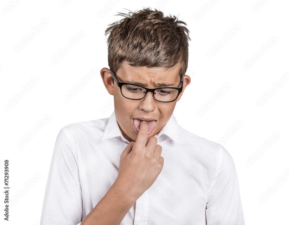 annoyed boy with finger in mouth, disgusted face expression annoyed boy with finger in mouth, disgusted face expression