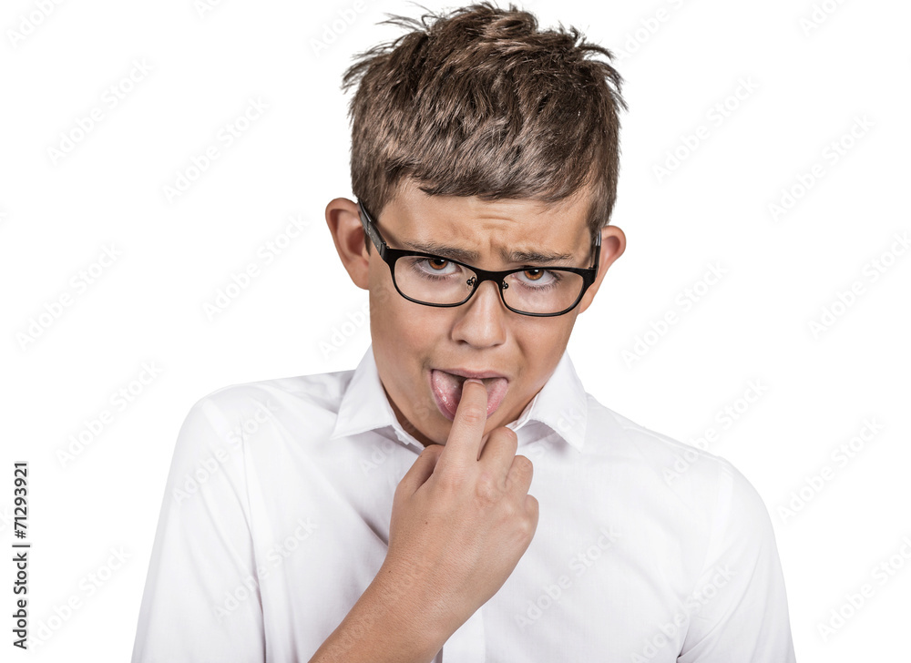 annoyed boy with finger in mouth, disgusted face expression annoyed boy with finger in mouth, disgusted face expression