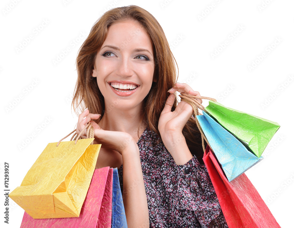 Beautiful young woman with shopping bags isolated on white Beautiful young woman with shopping bags isolated on white