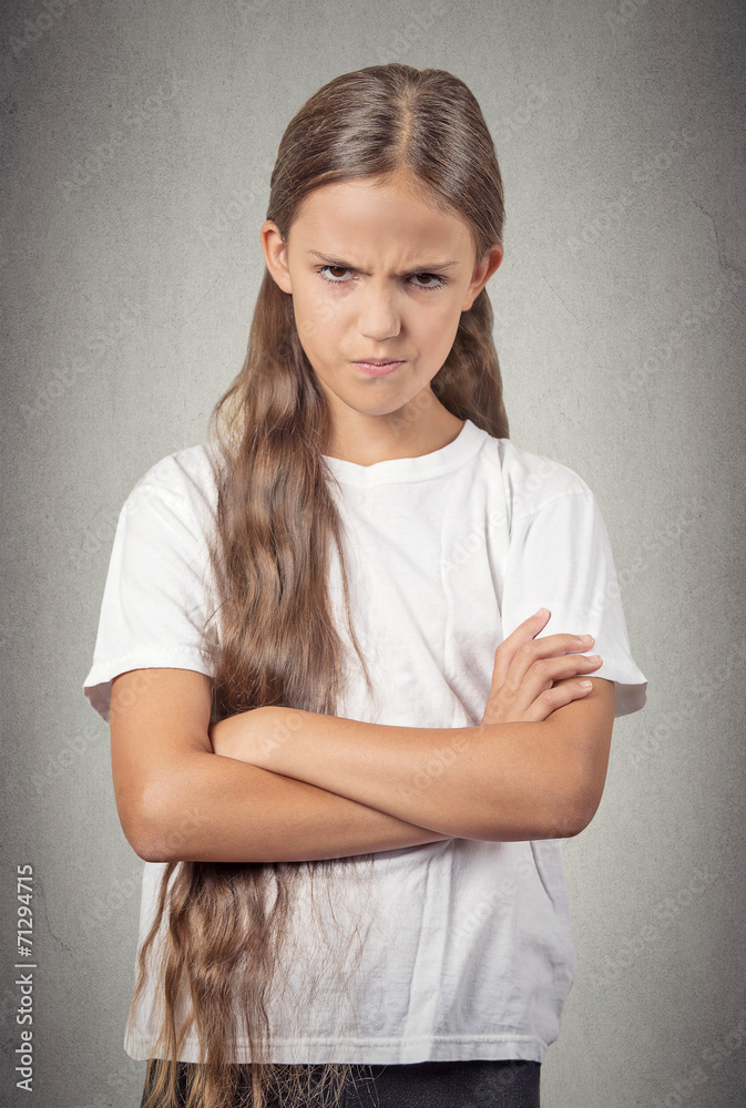 angry pissed off teenager girl isolated on grey background angry pissed off teenager girl isolated on grey background