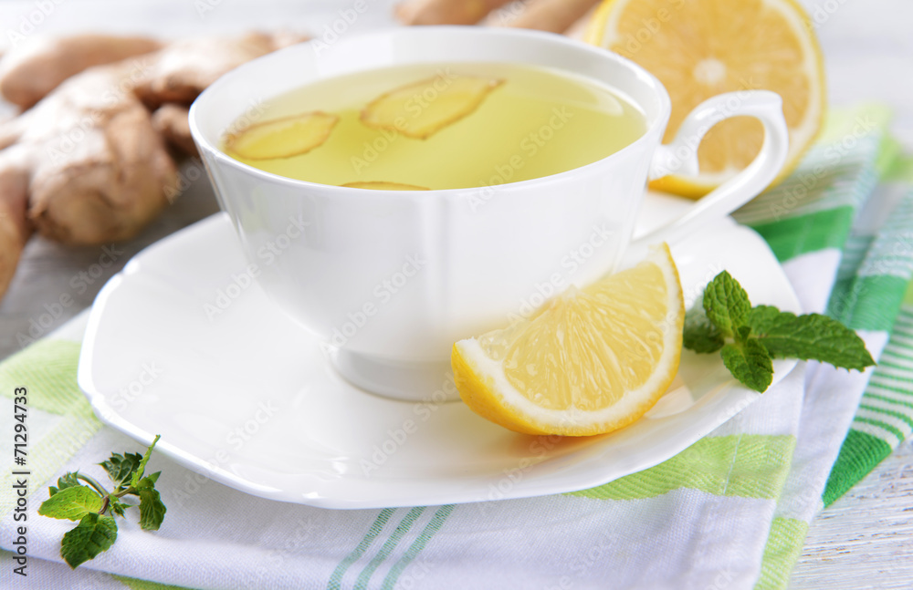 Ginger tea with lemon on table close-up Ginger tea with lemon on table close-up