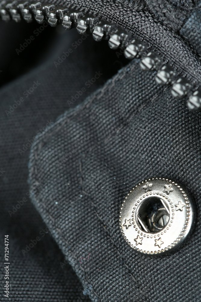 Zipper and button on clothes close up Zipper and button on clothes close up