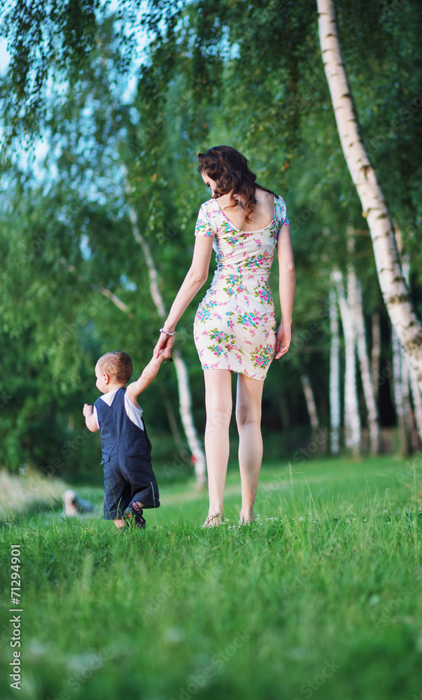 Pretty mother on the walk with child