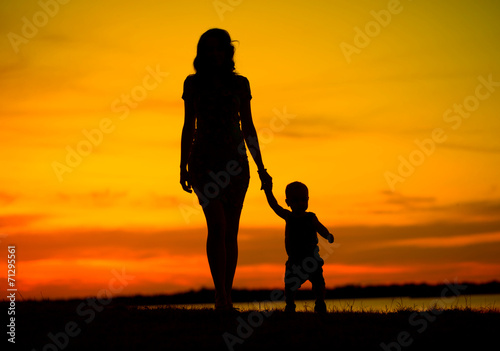 Attractive young mother on the walk with child