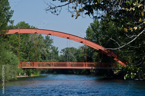 Canvas Print Red Bridge Extending Over the River