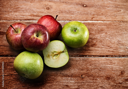 Apples on wooden background