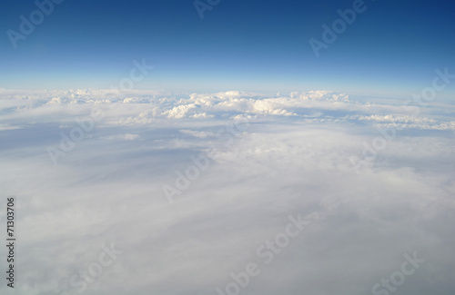clouds and blue sky seen from plane