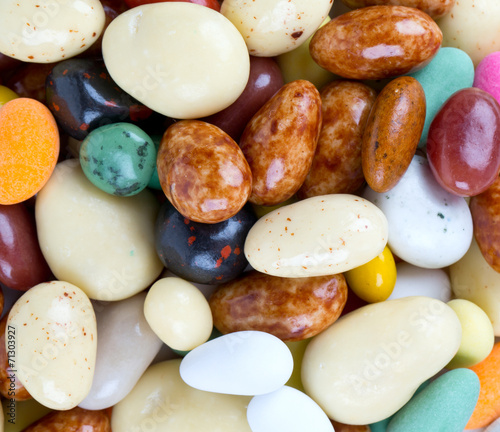 colorful glaced and chocolate covered nuts and raisins photo