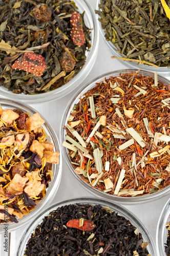 assortment of dry tea in glass bowls