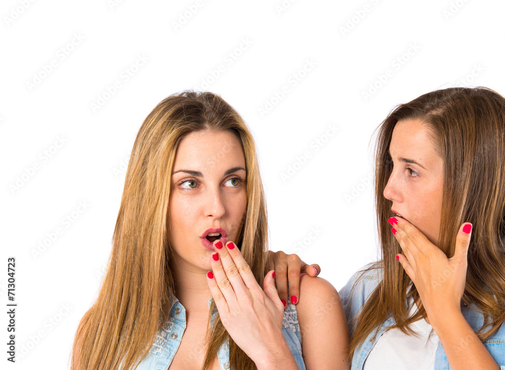 Friends doing surprise gesture over white background Friends doing surprise gesture over white background