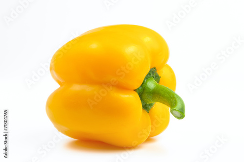 sweet yellow bell pepper on a white background illuminated