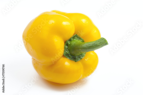 sweet yellow bell pepper on a white background illuminated