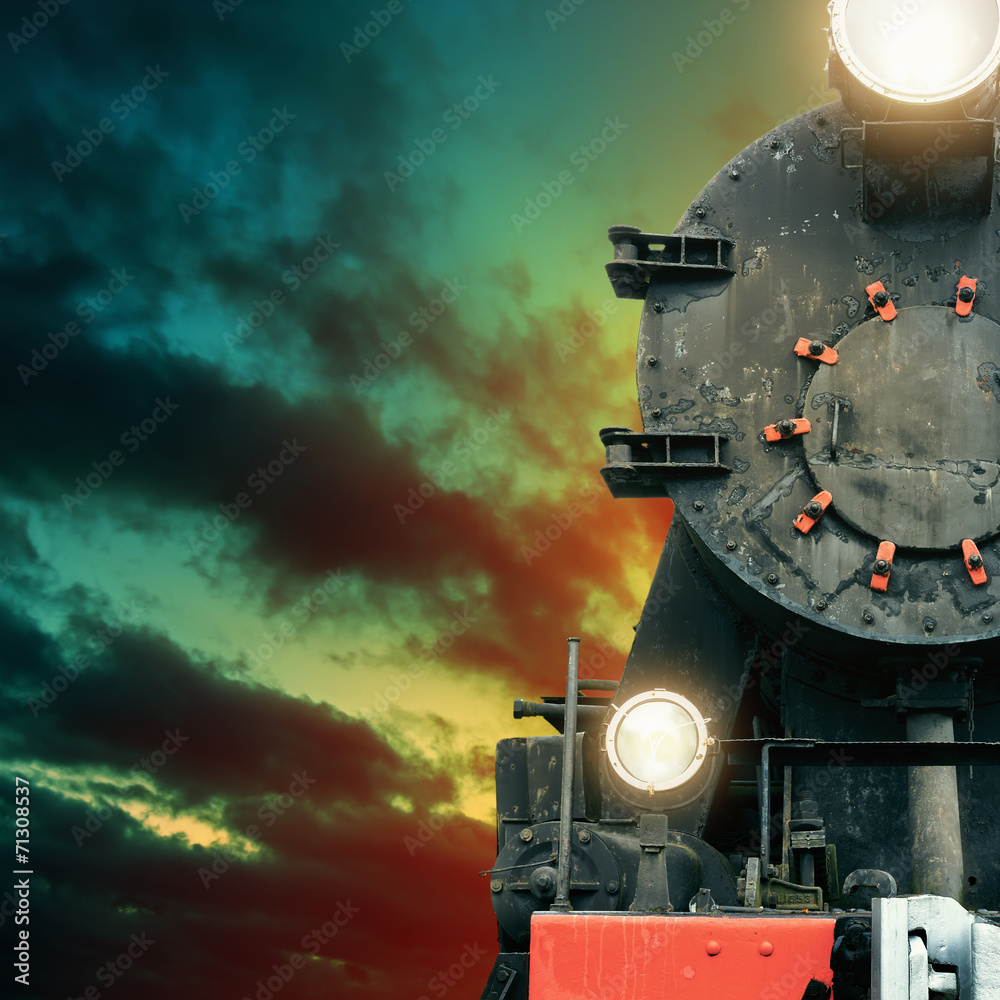 Black steam train at night
