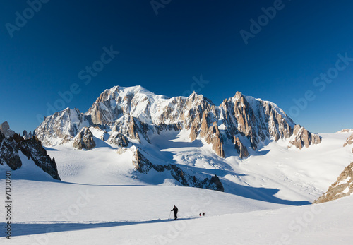 Ski mountaineers ascend the Vallee Blanche glacier. In backgroun photo