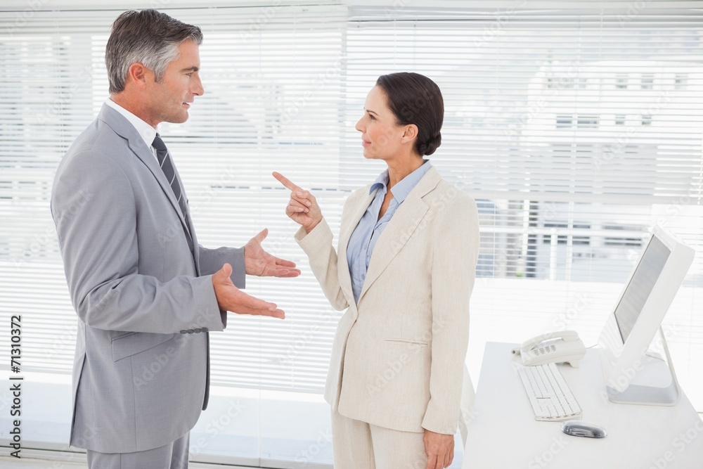 Businesswoman arguing with co worker Businesswoman arguing with co worker