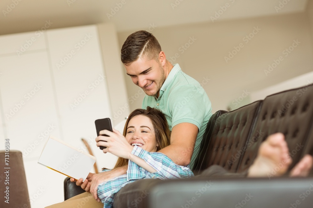 Cute couple relaxing on couch Cute couple relaxing on couch