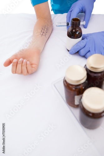 Doctor doing skin prick test at his patient