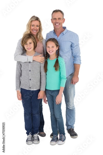 Happy family standing and smiling at camera