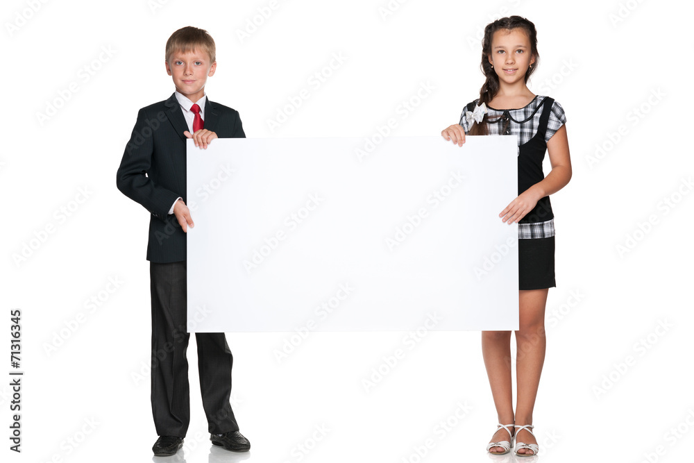 Two children hold a white board Two children hold a white board