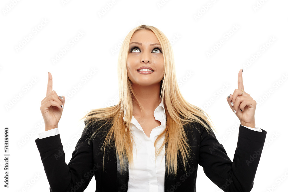 Attractive businesswoman pointing to the copyspace Attractive businesswoman pointing to the copyspace