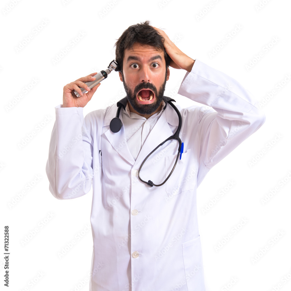 Crazy otorhinolaryngologist with his otoscope Crazy otorhinolaryngologist with his otoscope
