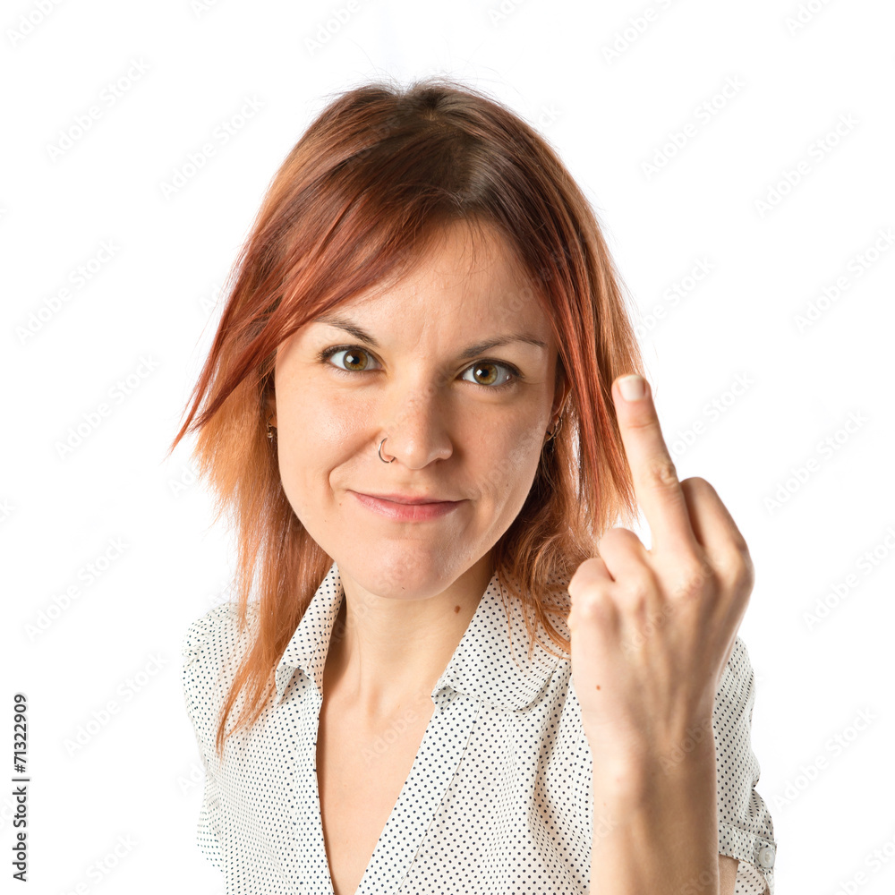 Girl making horn gesture over white background Girl making horn gesture over white background