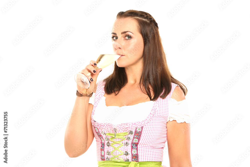 Junge Frau im Dirndl mit Prosecco Junge Frau im Dirndl mit Prosecco