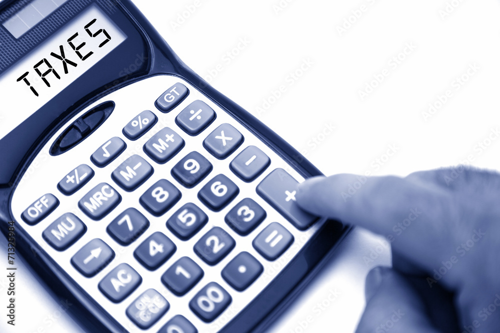 calculator with TAXES text on screen calculator with TAXES text on screen