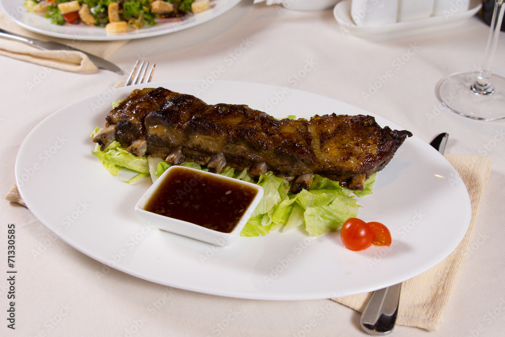 Plate of Ribs with Dipping Sauce Plate of Ribs with Dipping Sauce