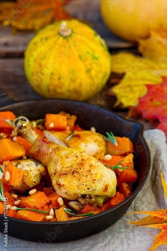 the baked chicken with pumpkin in a pig-iron frying pan