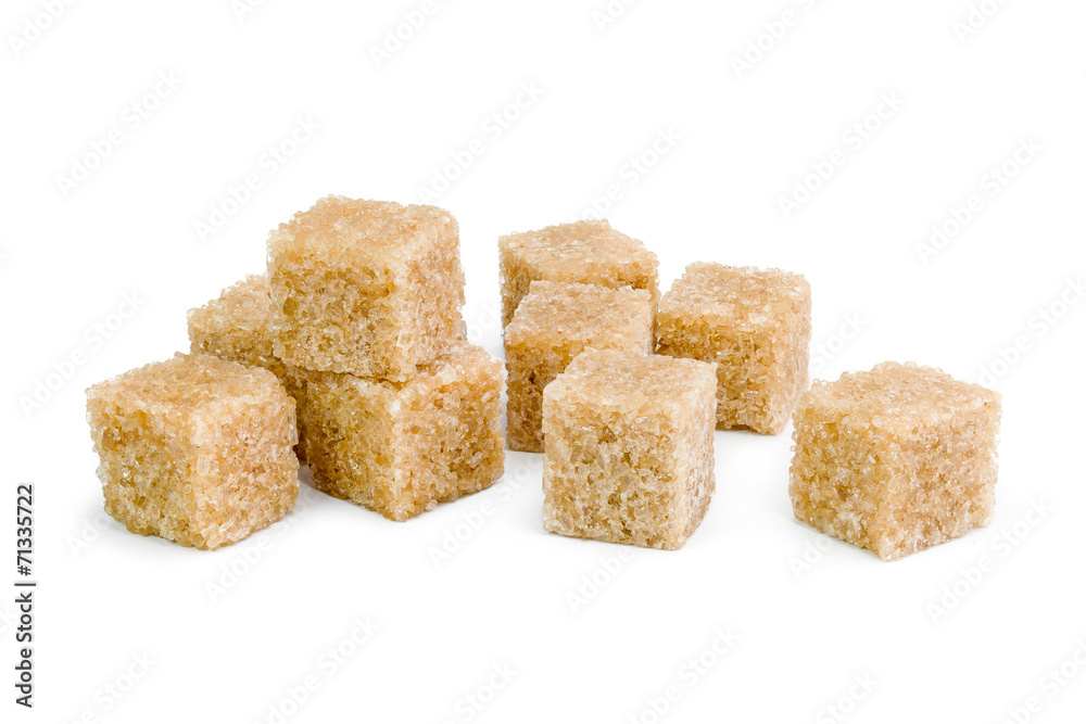 Brown sugar, a few pieces. Isolated on white Brown sugar, a few pieces. Isolated on white