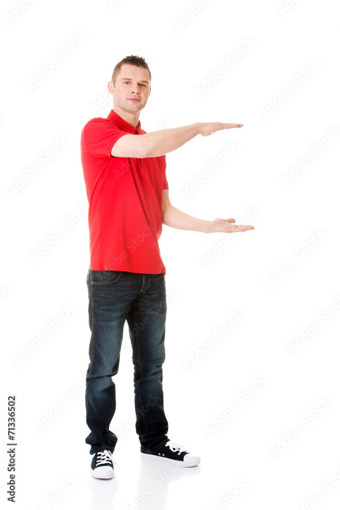 Excited man showing copy space Excited man showing copy space