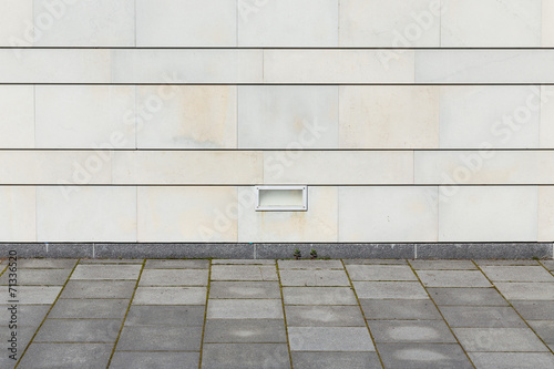square floor with modern stone wall © romantsubin