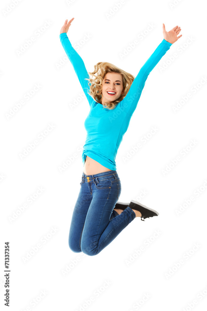 Young casual woman, student jumping.